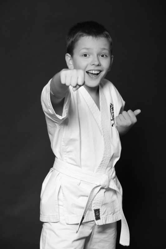 boy practicing karate punch