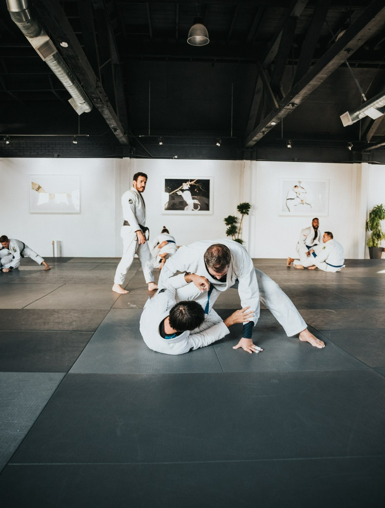 two men fighting on a mat