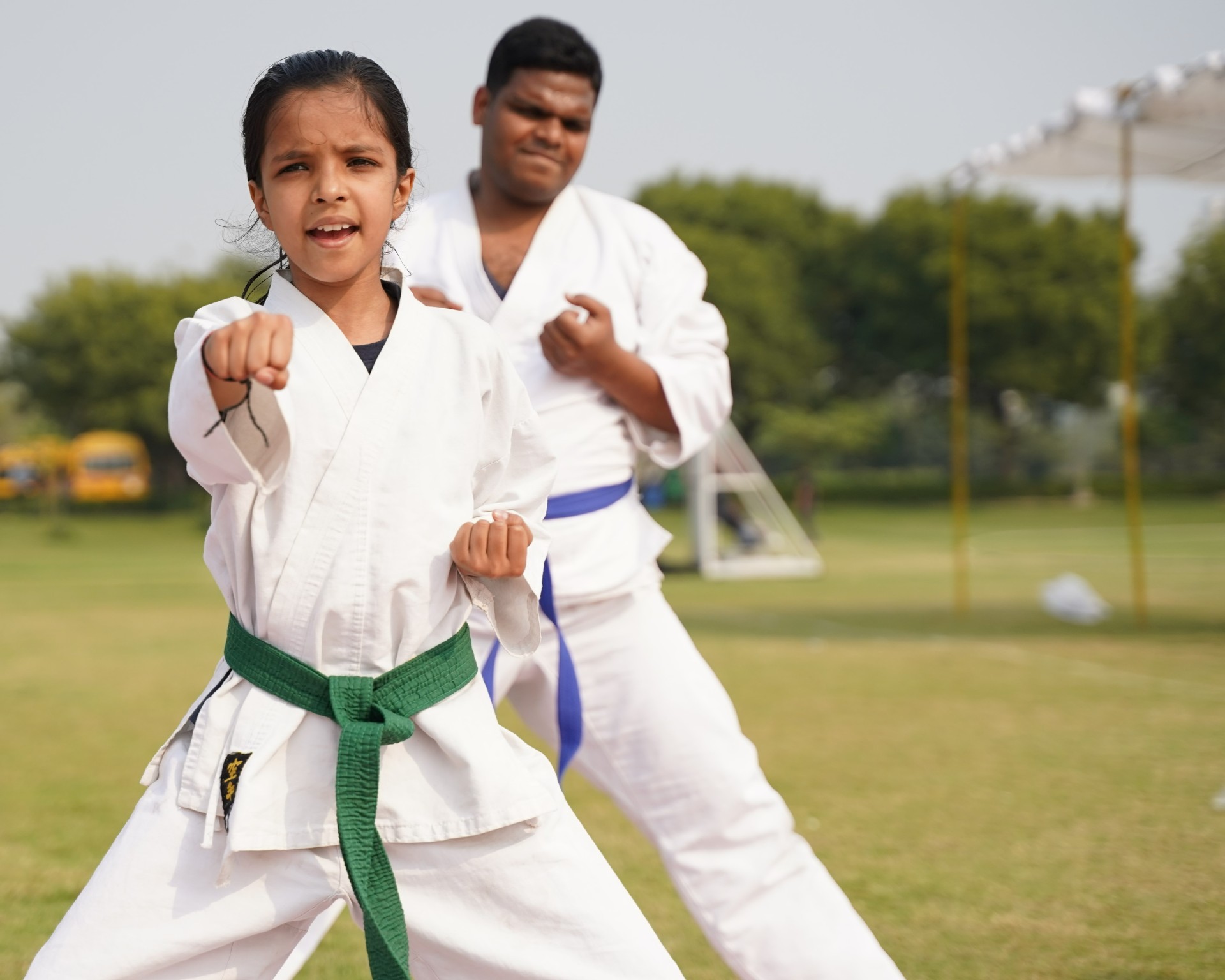 girl facing forward punching