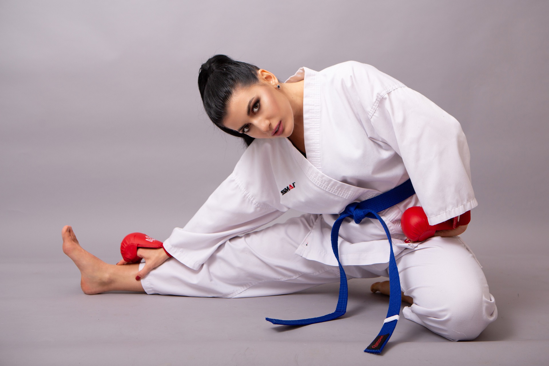 woman stretching leg on floor